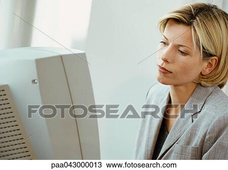 Businesswoman at computer screen View Large Photo Image Stock Image - Businesswoman at computer screen. Fotosearch