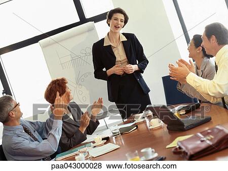 Group of business people in conference room, businesswoman being applauded View Large Photo Image Stock Photo - Group of business people in conference room, businesswoman being applauded. Fotosearch