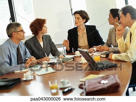 Group of business people in conference room View Large Photo Image Stock Photograph - Group of business people in conference room. Fotosearch