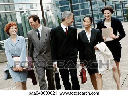 Group of business people walking side by side View Large Photo Image Stock Image - Group of business people walking side by side. Fotosearch