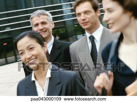 Group of business people walking, blurred, close-up View Large Photo Image Stock Photo - Group of business people walking, blurred, close-up. Fotosearch