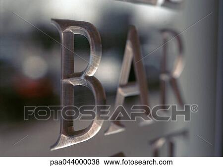 Stock Photo - Bar text engraved, close-up. Fotosearch