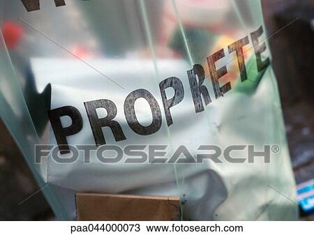 Stock Image - Cleanliness printed in French on garbage bag, close-up. Fotosearch
