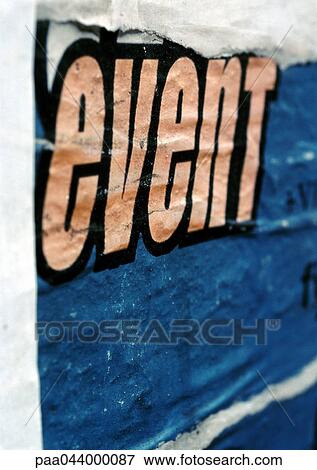 Stock Photo - Event text printed on torn poster, close-up. Fotosearch