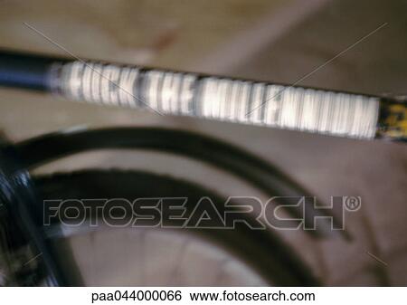 Insulting text on bicycle, close-up, blurred View Large Photo Image Stock Photograph - Insulting text on bicycle, close-up, blurred. Fotosearch