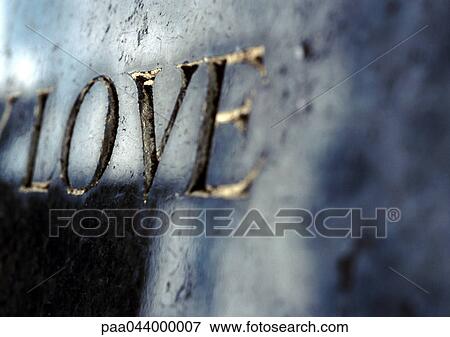 Love text embossed in gold View Large Photo Image Stock Photo - Love text embossed in gold. Fotosearch