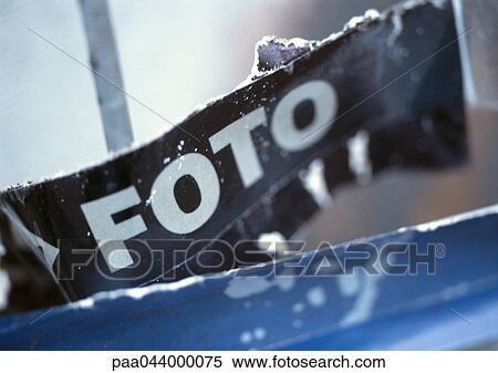 Stock Photography - Photo text in Spanish printed on poster, close-up. Fotosearch