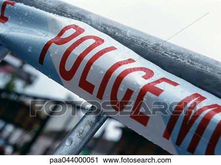 Police text on police line, close-up View Large Photo Image Stock Image - Police text on police line, close-up. Fotosearch