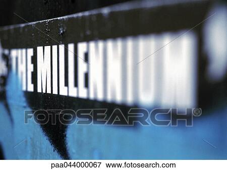Stock Photo - The millenium text printed in capital letters, blurred. Fotosearch