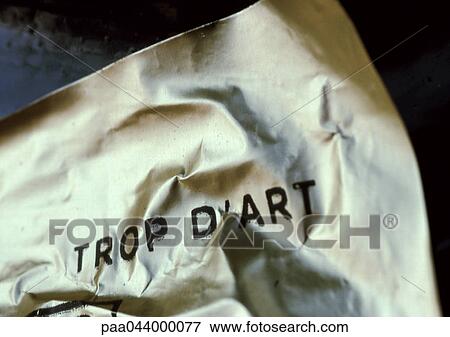Stock Photo - Too much art text in French on printed on crumpled paper. Fotosearch
