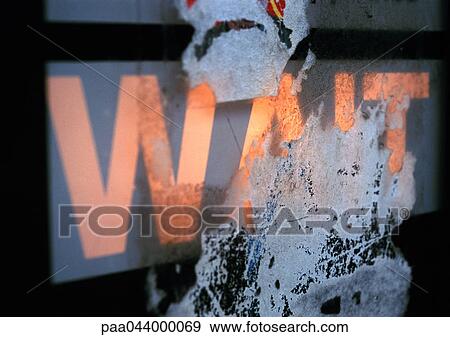 Wait text on crosswalk sign, partially obscured, close-up View Large Photo Image Stock Photo - Wait text on crosswalk sign, partially obscured, close-up. Fotosearch