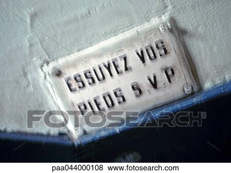 Stock Photo - Wipe your feet please text in French. Fotosearch