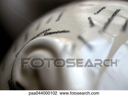 Stock Image - Words printed on curved surface. Fotosearch
