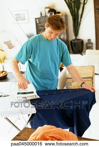 Man ironing clothes View Large Photo Image Stock Photograph - Man ironing clothes. Fotosearch