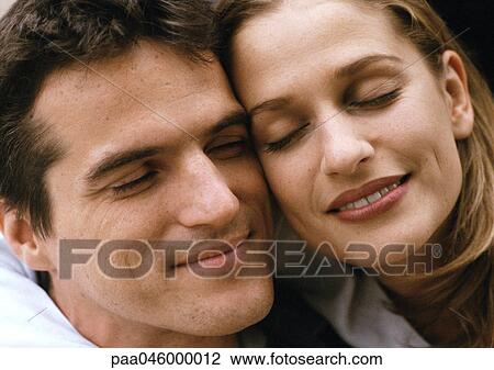 Couple cheek to cheek, close-up View Large Photo Image Stock Image - Couple cheek to cheek, close-up. Fotosearch