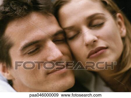 Couple cheek to cheek, close-up View Large Photo Image Stock Photo - Couple cheek to cheek, close-up. Fotosearch