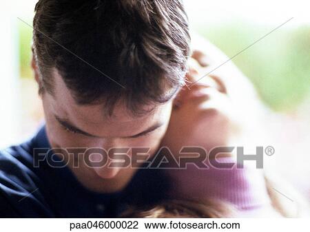 Couple embracing, close-up, blurred View Large Photo Image Stock Image - Couple embracing, close-up, blurred. Fotosearch