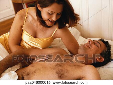 Couple in bed, smiling View Large Photo Image Stock Photography - Couple in bed, smiling. Fotosearch