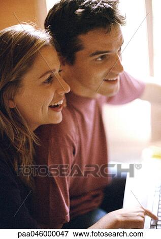 Man and woman side by side, smiling, side view View Large Photo Image Stock Photo - Man and woman side by side, smiling, side view. Fotosearch