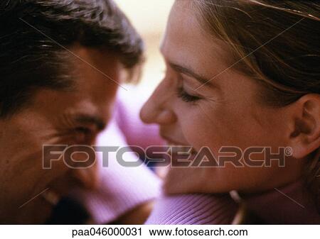 Man and woman smiling, close-up, side view View Large Photo Image Stock Image - Man and woman smiling, close-up, side view. Fotosearch