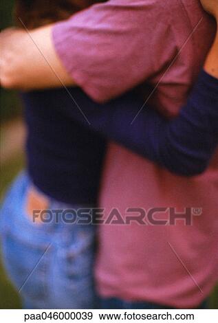 Two people hugging, mid-section, blurred View Large Photo Image Stock Photo - Two people hugging, mid-section, blurred. Fotosearch