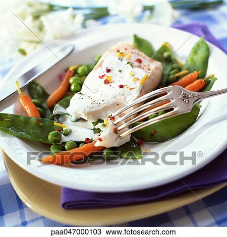 Stock Image - Bowl of fish and spring vegetables, close-up. Fotosearch