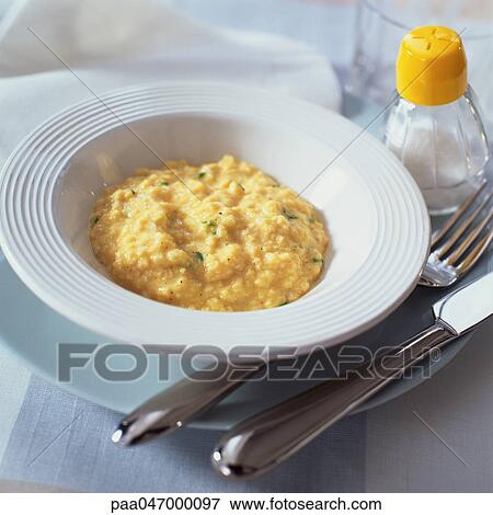 Bowl of risotto, silverware and salt shaker, close-up View Large Photo Image Stock Photo - Bowl of risotto, silverware and salt shaker, close-up. Fotosearch