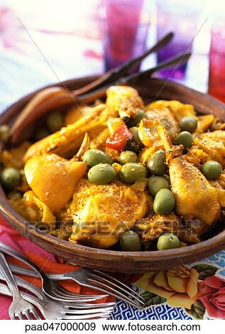 Chicken tagine, with green olives, in bowl, close-up View Large Photo Image Stock Photo - Chicken tagine, with green olives, in bowl, close-up. Fotosearch