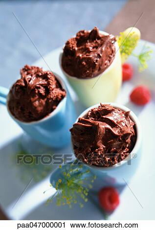 Stock Image - Chocolate mousse in small cups, close-up. Fotosearch