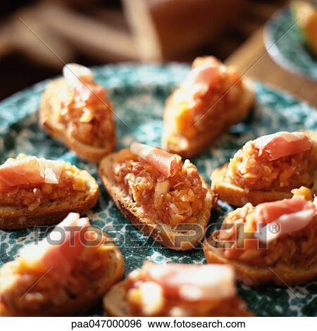 Crostini topped with canteloupe and ham, close-up View Large Photo Image Stock Photograph - Crostini topped with canteloupe and ham, close-up. Fotosearch