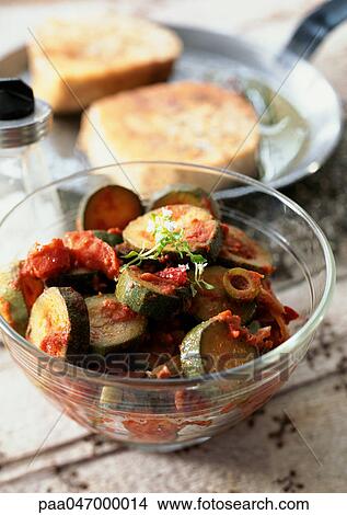 Dish of zucchini with tomato, olives and herbs, close-up View Large Photo Image Picture - Dish of zucchini with tomato, olives and herbs, close-up. Fotosearch