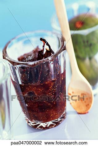 Fig preserves in jar next to wooden spoon, close-up View Large Photo Image Stock Image - Fig preserves in jar next to wooden spoon, close-up. Fotosearch