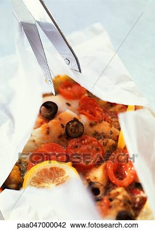 Stock Image - Fish, olives and tomatoes in cooking paper. Fotosearch