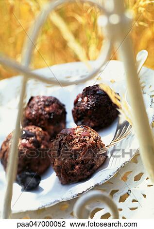 Stock Image - Goat cheese with olives, close-up. Fotosearch
