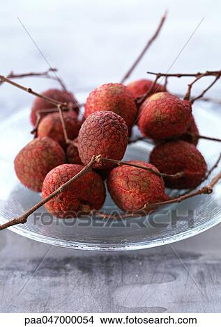 Picture - Lychees with branches, close-up. Fotosearch