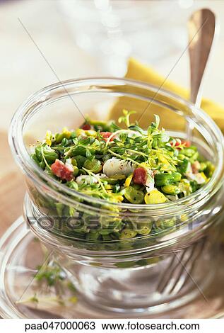 Stock Image - Mixed salad in glass bowl, close-up. Fotosearch