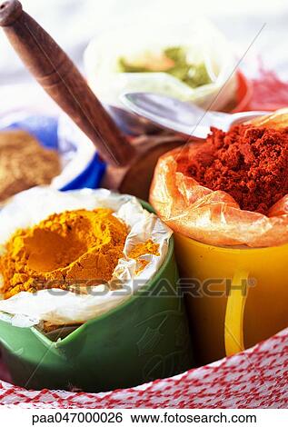 Mugs of yellow and red spices, close-up View Large Photo Image Stock Photograph - Mugs of yellow and red spices, close-up. Fotosearch