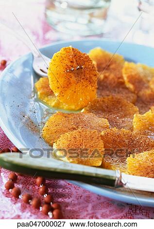 Orange slices sprinkled with cinnamon on plate, close-up View Large Photo Image Stock Photo - Orange slices sprinkled with cinnamon on plate, close-up. Fotosearch