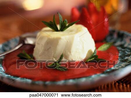 Panacotta, with red fruit coulis and mint leaves, close-up View Large Photo Image Stock Image - Panacotta, with red fruit coulis and mint leaves, close-up. Fotosearch
