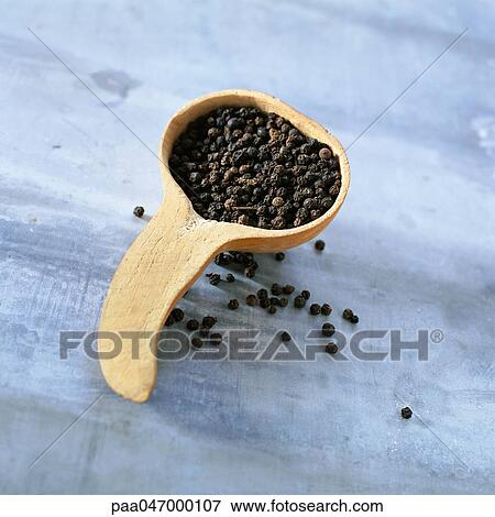 Peppercorns in wooden scoop, close-up View Large Photo Image Stock Photo - Peppercorns in wooden scoop, close-up. Fotosearch