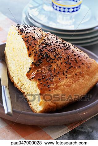 Piece of bread with topped with black seeds (khobz koucha), close-up View Large Photo Image Stock Photo - Piece of bread with topped with black seeds (khobz koucha), close-up. Fotosearch