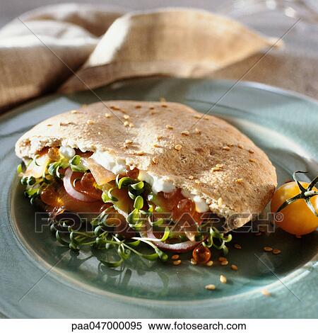 Pita sandwhich filled with feta cheese, salmon roe and sprouts, close-up View Large Photo Image Stock Photography - Pita sandwhich filled with feta cheese, salmon roe and sprouts, close-up. Fotosearch