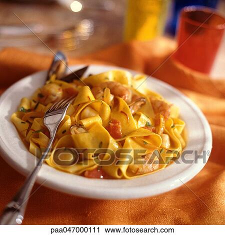 Stock Image - Plate of pasta with tomato sauce, close-up. Fotosearch