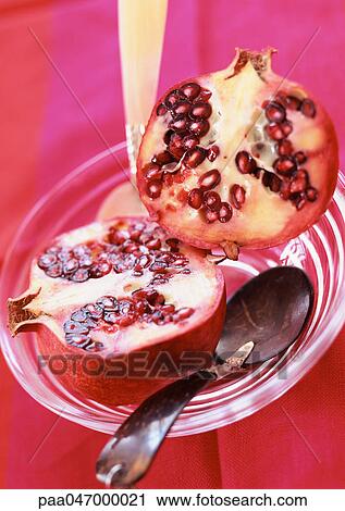 Pomegranate cut in half, in bowl with spoon, close-up View Large Photo Image Stock Image - Pomegranate cut in half, in bowl with spoon, close-up. Fotosearch