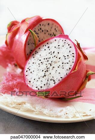 Red pitaya cut in half, close-up View Large Photo Image Picture - Red pitaya cut in half, close-up. Fotosearch