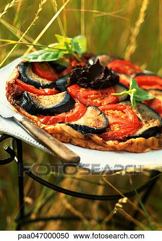 Tomato and eggplant tart with tapenade View Large Photo Image Stock Image - Tomato and eggplant tart with tapenade. Fotosearch
