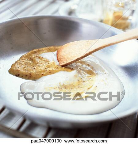 Wooden spoon stirring sauce, close-up View Large Photo Image Stock Image - Wooden spoon stirring sauce, close-up. Fotosearch