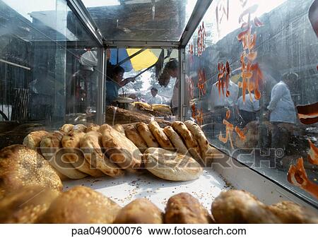 China, Beijing, bread being sold in street market View Large Photo Image Stock Photograph - China, Beijing, bread being sold in street market. Fotosearch