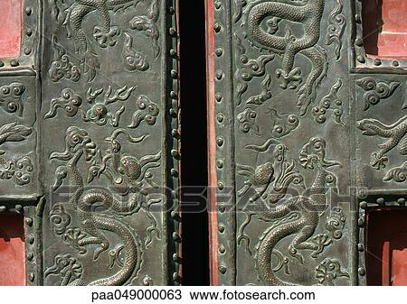 Stock Image - China, Beijing, Forbidden City, dragon motif carving on door. Fotosearch