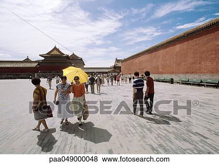 Stock Photo - China, Beijing, people in Forbidden City courtyard. Fotosearch